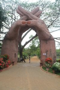 clasped hands brickwork